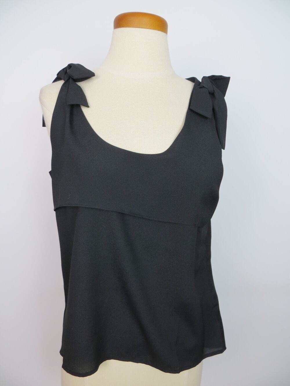 Naked Zebra Black Top Size Medium Scoop Neck Bows High Low Hand Wash Polyester